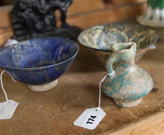 Ancient pottery small jug, blue glaze traces (possibly Roman) and two Iznik polychrome-glazed pottery bowls